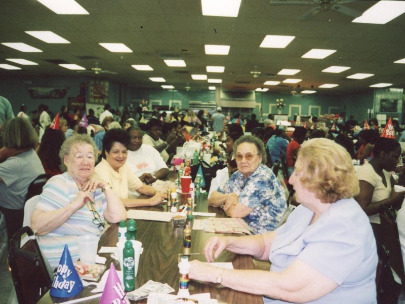 a group of older women playing bingo