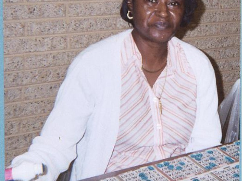 a woman prepares to stamp bingo cards