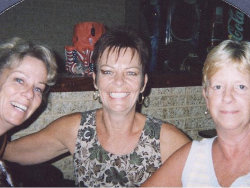 a trio of women smile at bingo