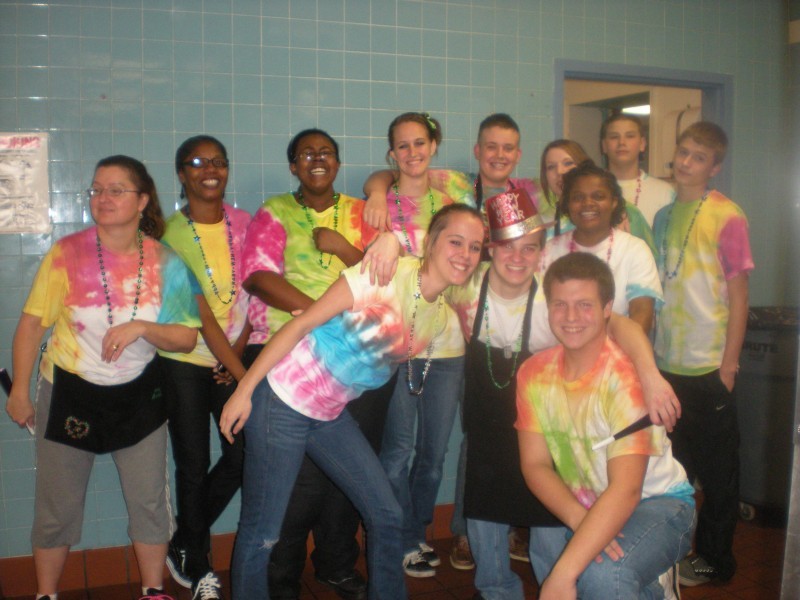 a group of people in tie dye shirts