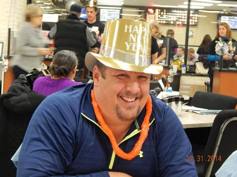 happy man in a bright gold top hat 