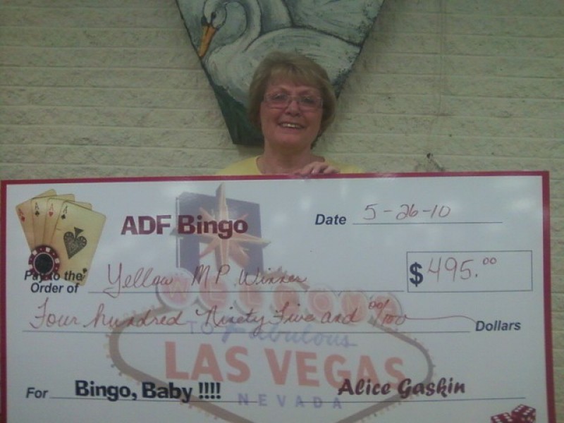 a woman stands behind bingo check