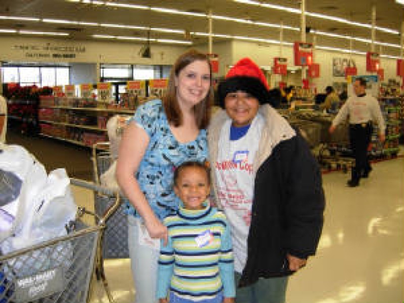 woman in store with two children 