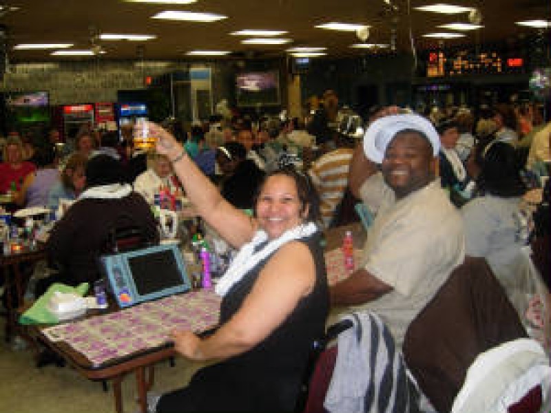 man and woman raise a toast at bingo