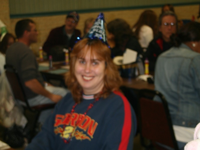 woman in party hat celebrates new years