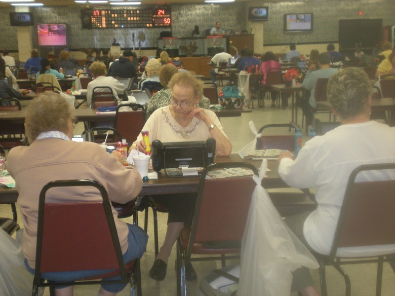 A bingo hall with some empty seats