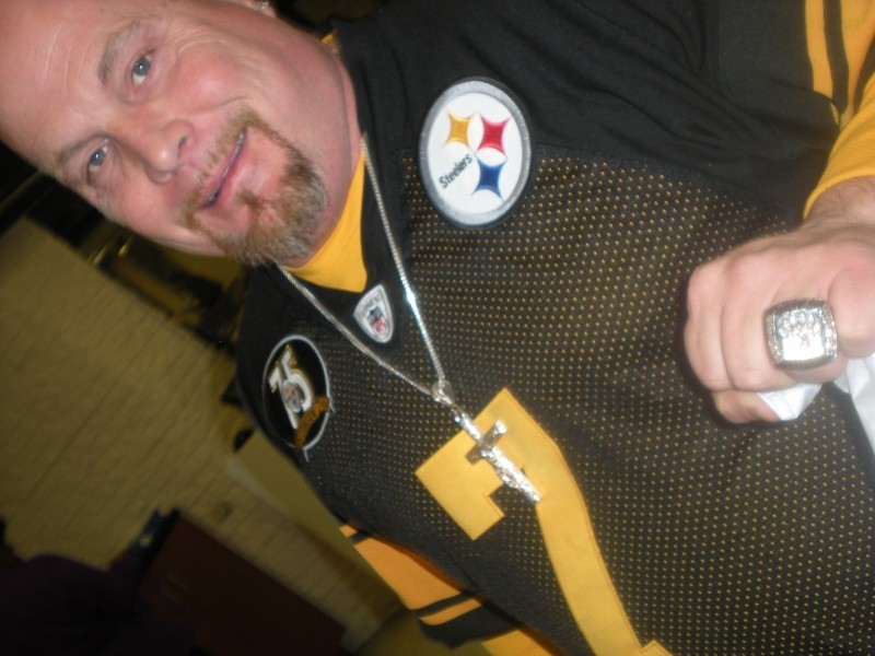 man in a Pittsburgh Steelers jersey 