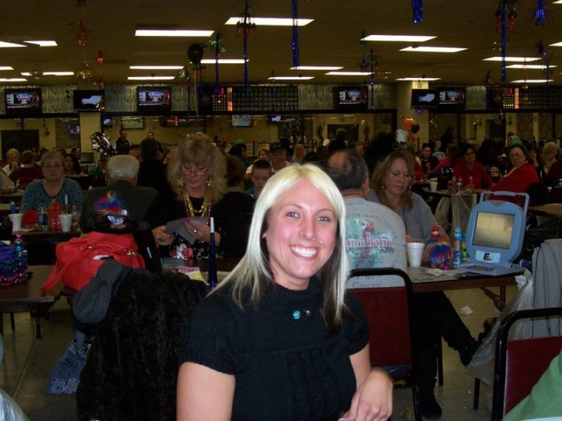 woman with blond hair smiles at bingo