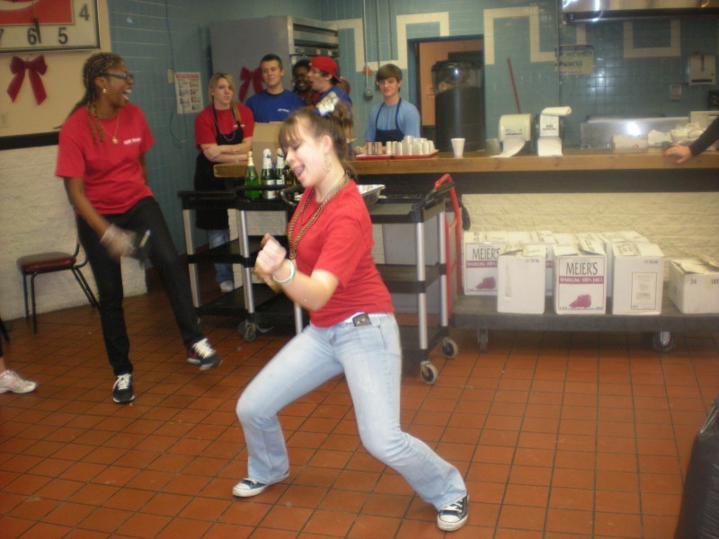 woman in red dancing in the kitchen