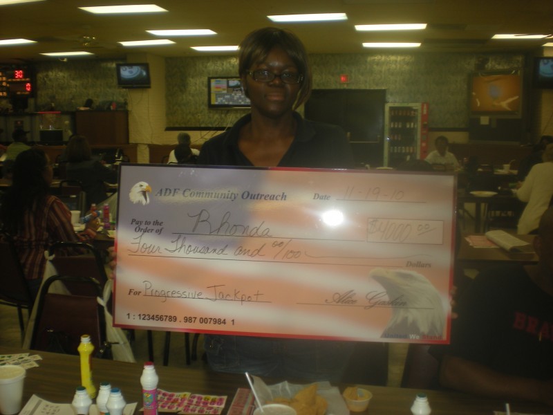 bingo winner holding her check